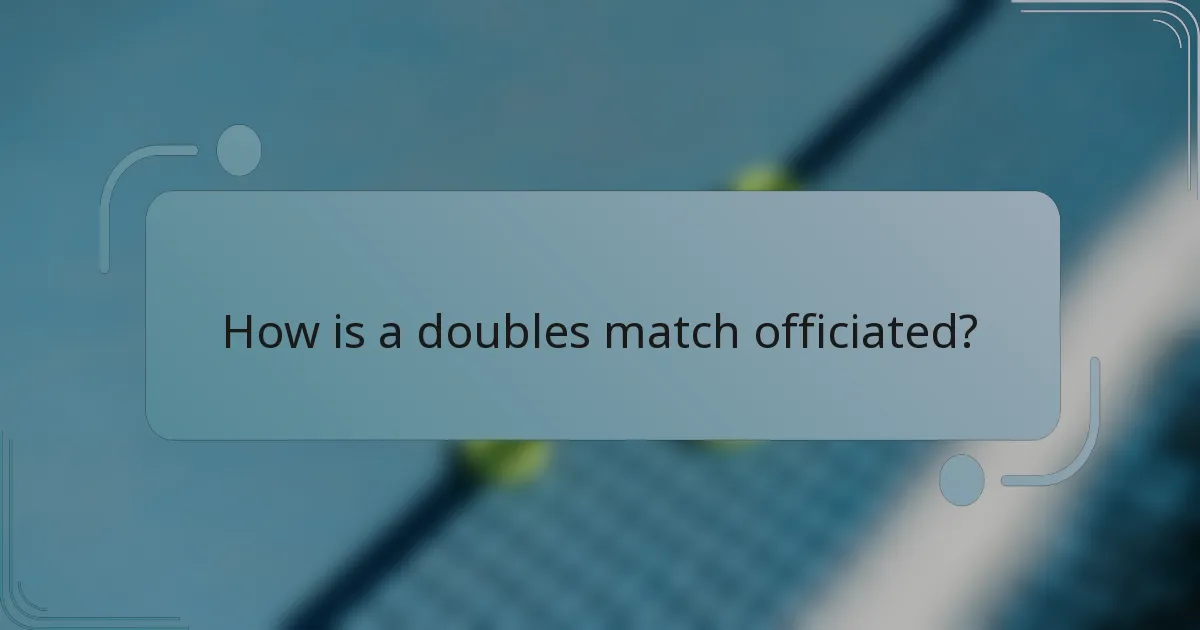 How is a doubles match officiated?